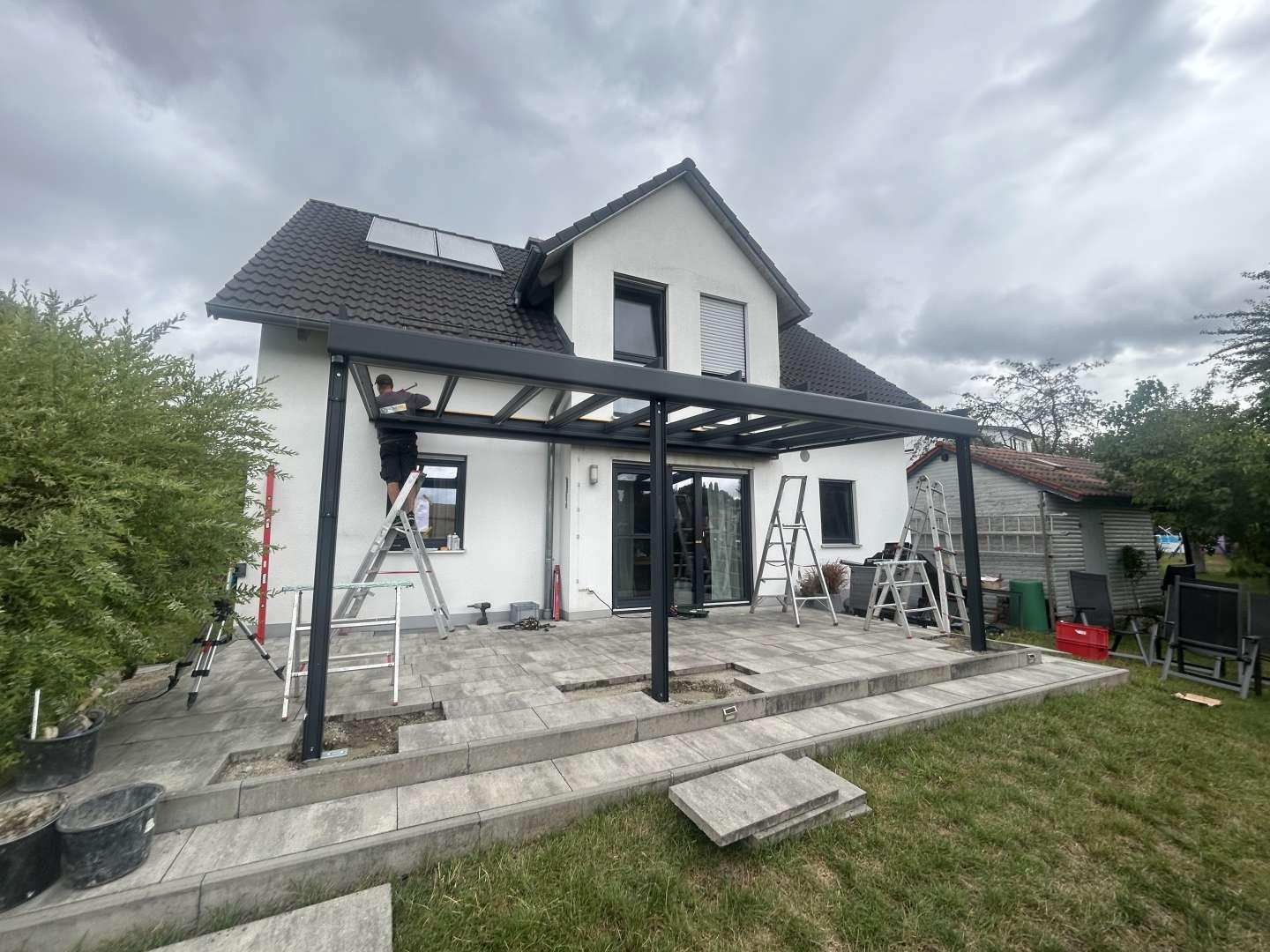A1 Round Rock crew installing an aluminum patio cover on a two-story home in Teravista