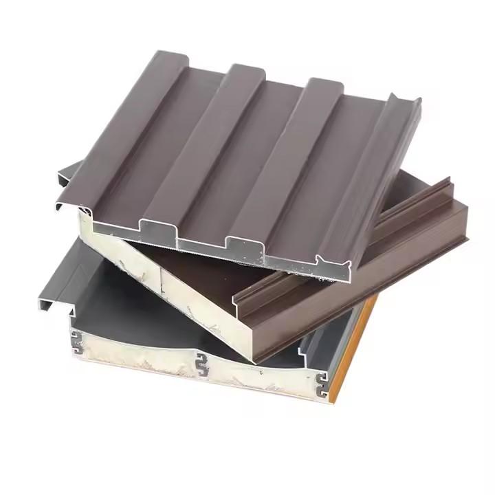 Cutaway of an insulated aluminum roof panel showing the foam core between two aluminum skins