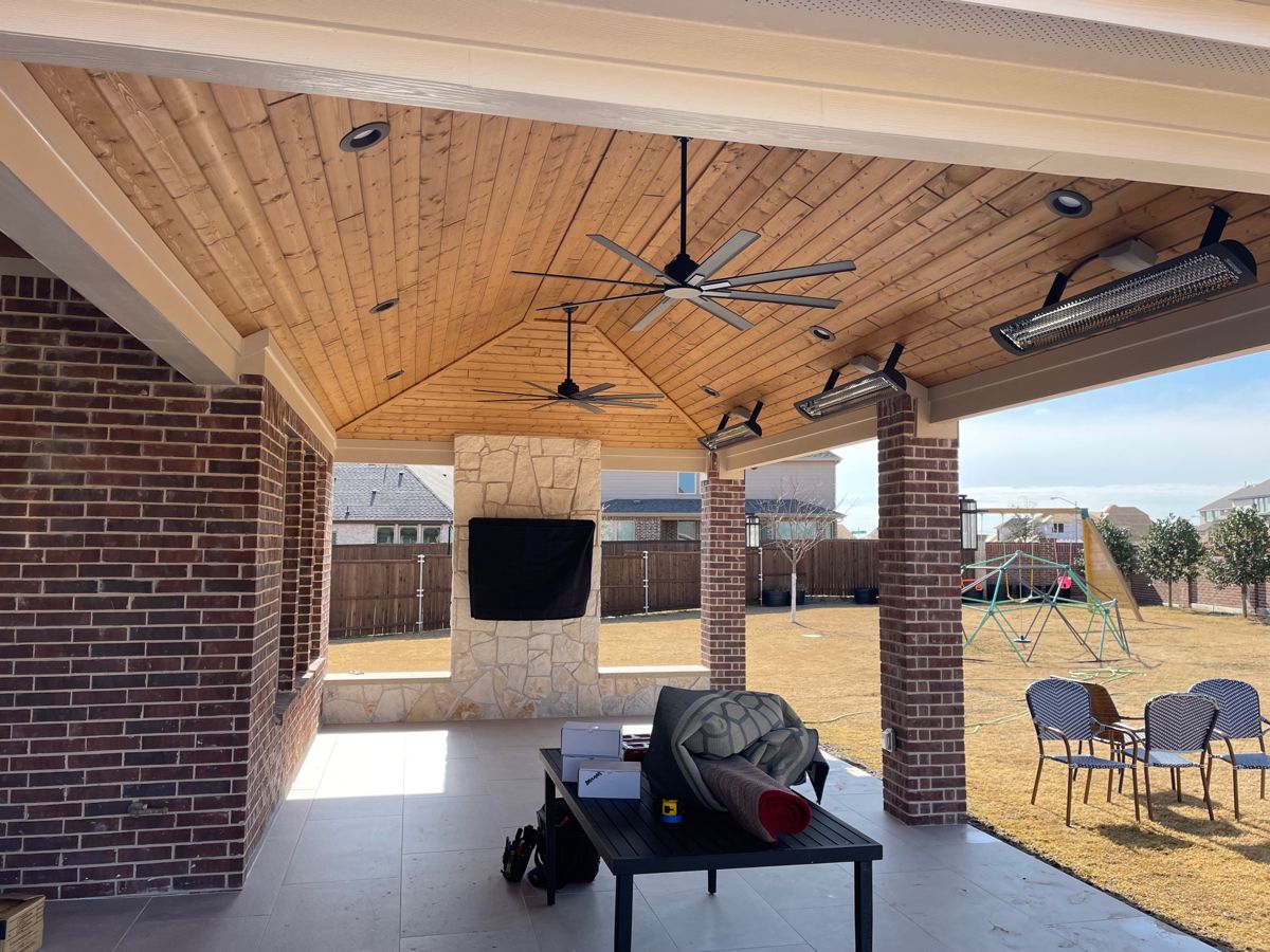Ceiling fan and recessed lights being installed on an existing patio cover in Round Rock