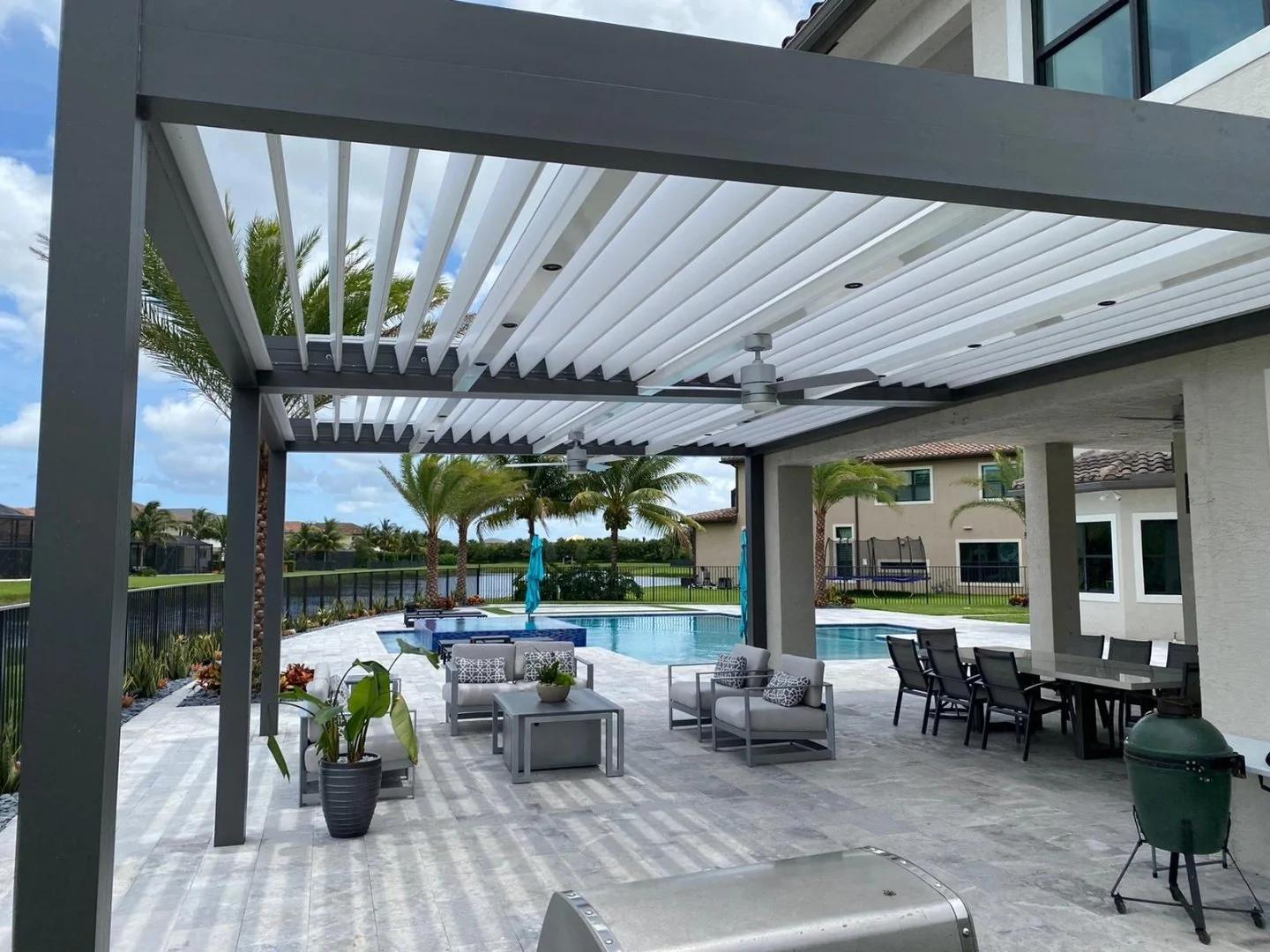 Motorized louvered pergola with louvers angled for shade over a pool deck in Round Rock