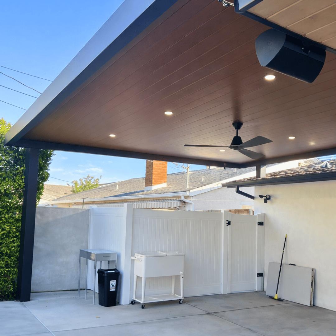 Insulated aluminum patio cover with ceiling fans in Teravista, Round Rock
