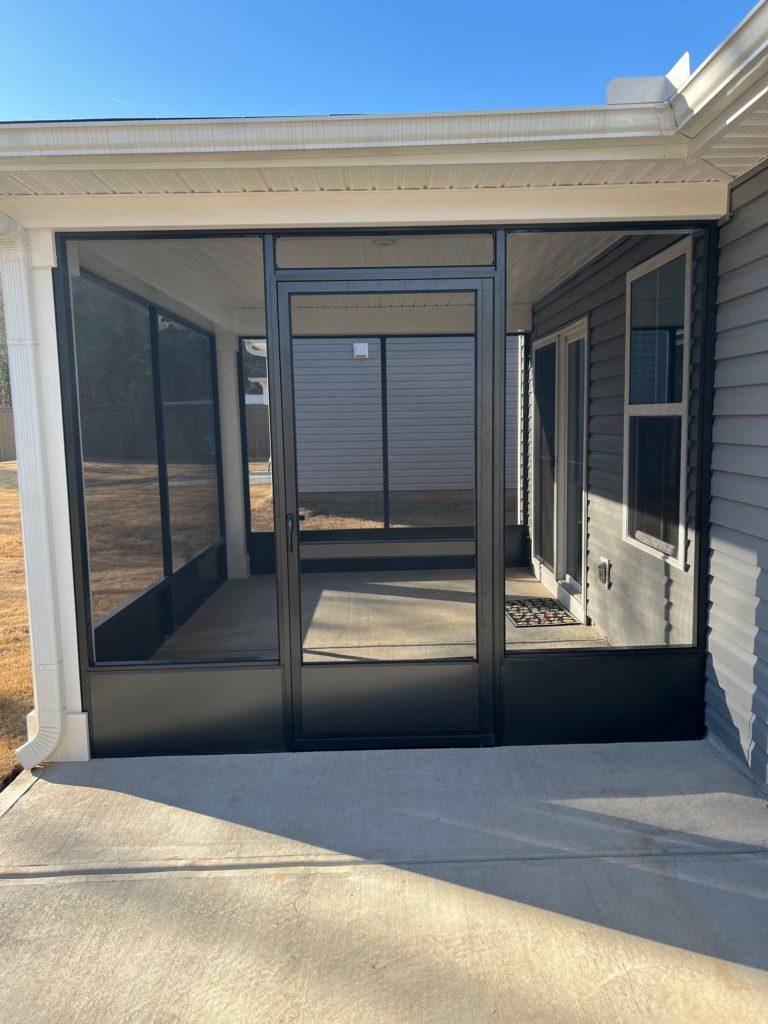 Screen room framing, kick plate and screen door detail on a Round Rock patio