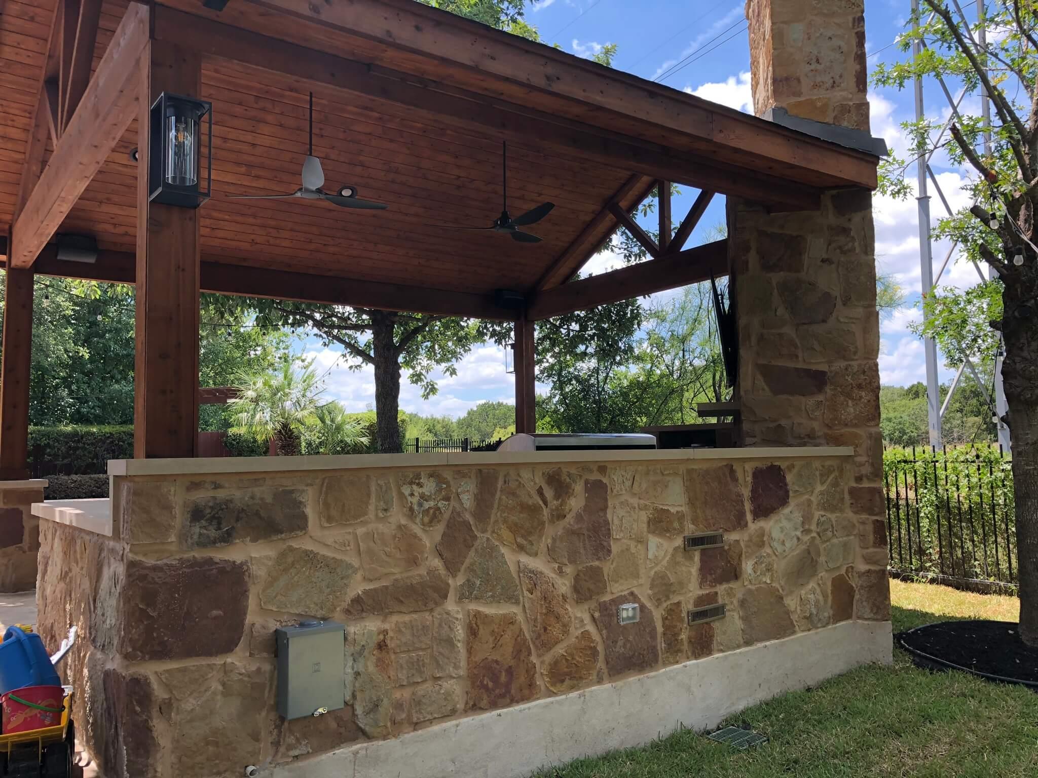 Wood pergola over outdoor kitchen in Paloma Lake, Round Rock